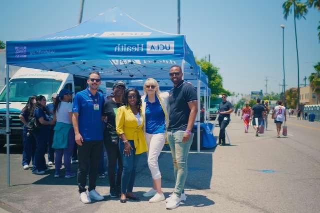 Mikel Whittier, from left, Becky Mancuso-Winding, Dr. Medell Briggs-Malonson, Shonda Peterson and Matthew Flesock were among those who represented UCLA Health at the New Orleans Corridor ribbon-cutting. (Photo by Milo Mitchell)